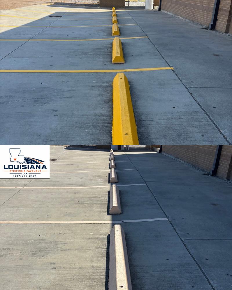 Concrete wheel stops painted safety yellow at Kinder High School, shown above the unpainted before photo
